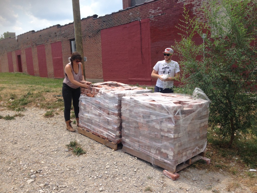 Inspecting the bricks obtained from Century Used Brick.