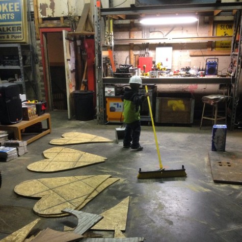 A volunteer in the heart-making shop, known as the "Bomb Door."